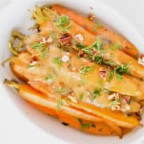 Glazed carrots viewed from overhead in an oval bowl