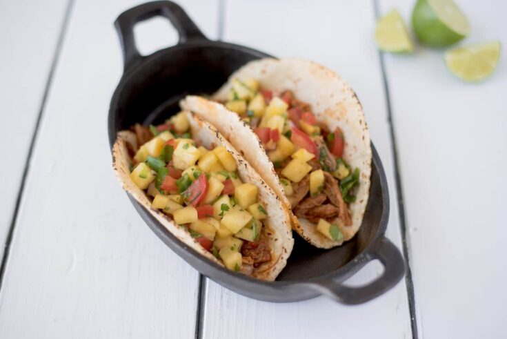 2 carnitas pork tacos with pineapple salsa