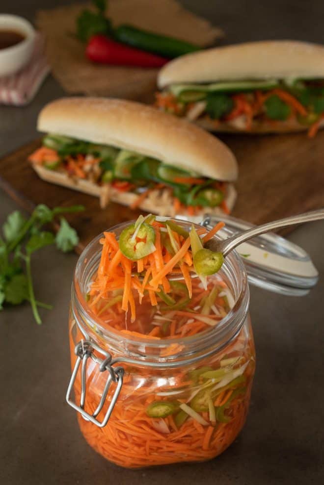The spicy carrot slaw with spring onion and jalape&ntilde;o on a fork