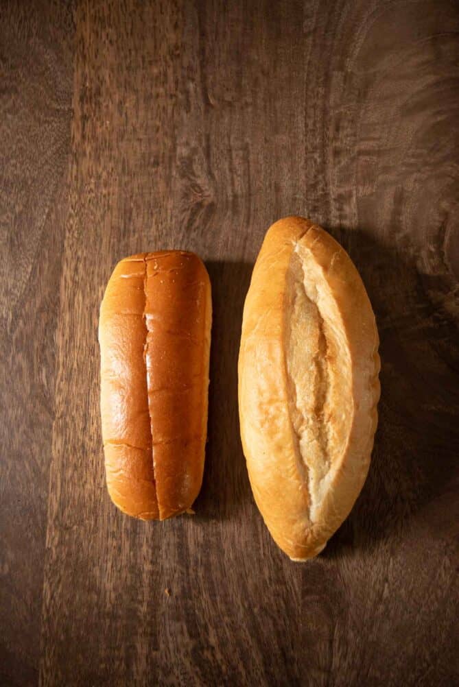 A regular hot dog bun and a Mexican bolillo bun