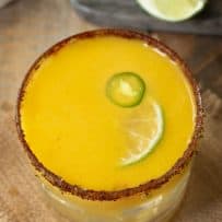 The drink from above showing the lime and jalapeño garnish and spicy salt rim