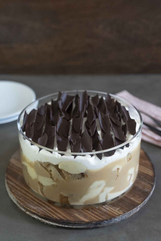 Chocolate shards garnish the top of a trifle