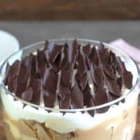 Layers of date sponge cake, custard, toffee sauce, cream and chocolate made into a trifle