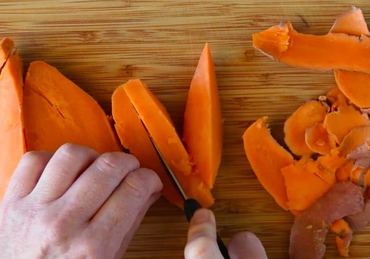 Cooked sweet potatoes being diced