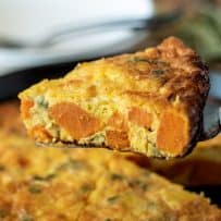 Large pieces of orange yam inside a frittata slice