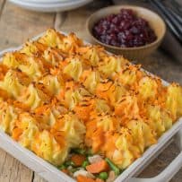 Turkey and vegetables topped with colorful mashed potato