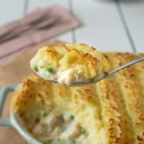 Serving a spoonful of fish pie