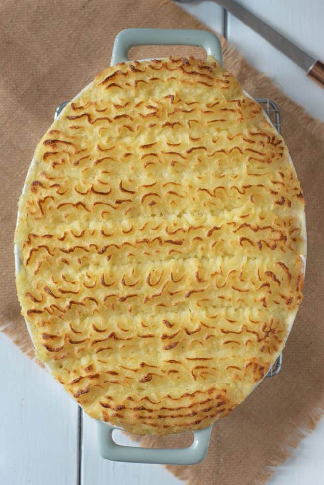 British fish pie in an oval dish topped with mashed potato