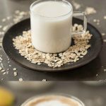 Oat milk in a glass mug and a latte made with oat milk