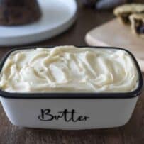 A rectangle butter dish filled with brandy butter