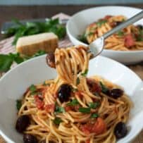 Twirling a bite of spaghetti onto a fork