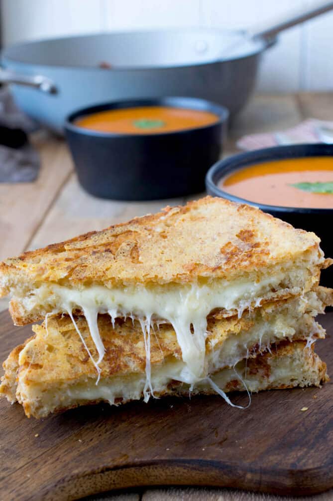 2 halves of a grilled cheese sandwich stacked on top of each other