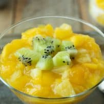 Chopped kiwi, mango and pineapple served on top of chilled rice pudding