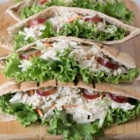 A closeup showing the crisp lettuce, tuna filling and sweet slices of grape