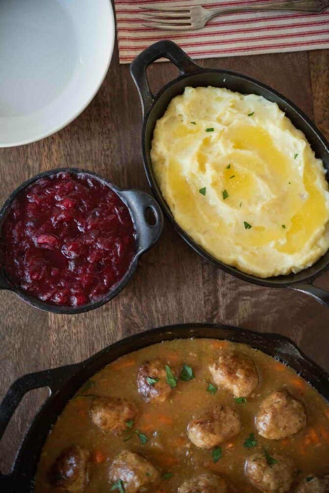 Mashed potato, cranberry sauce and a meatball casserole