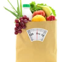 Fruits and vegetables in a brown grocery bag