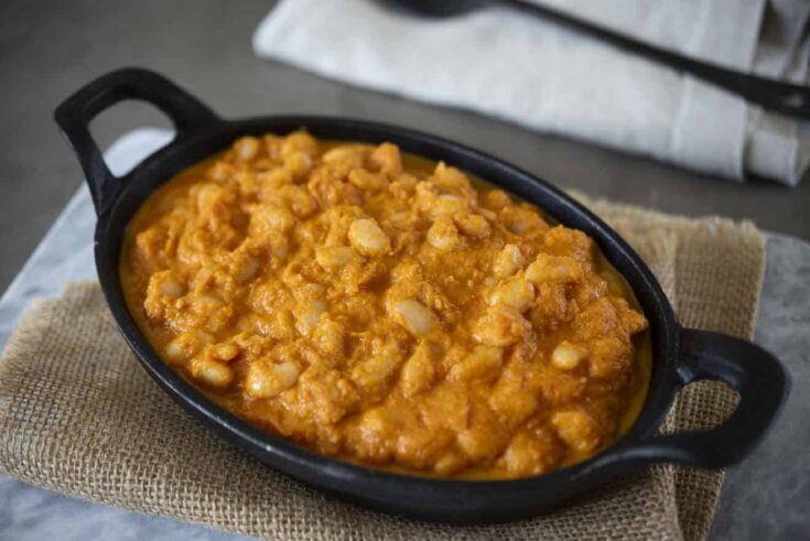Baked beans in a tomato sauce served in an oval dish