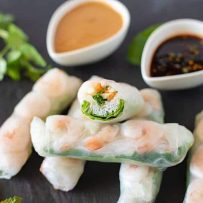 A closeup of the inside of one of the rolls, green white and orange colors