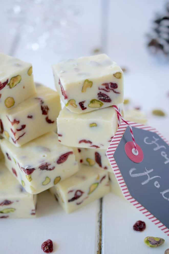 White Chocolate Pistachio Cranberry Fudge cut showing the pieces of pistachios and dried cranberries inside