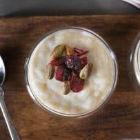 Dried cranberries and toasted pistachios on top of rice pudding