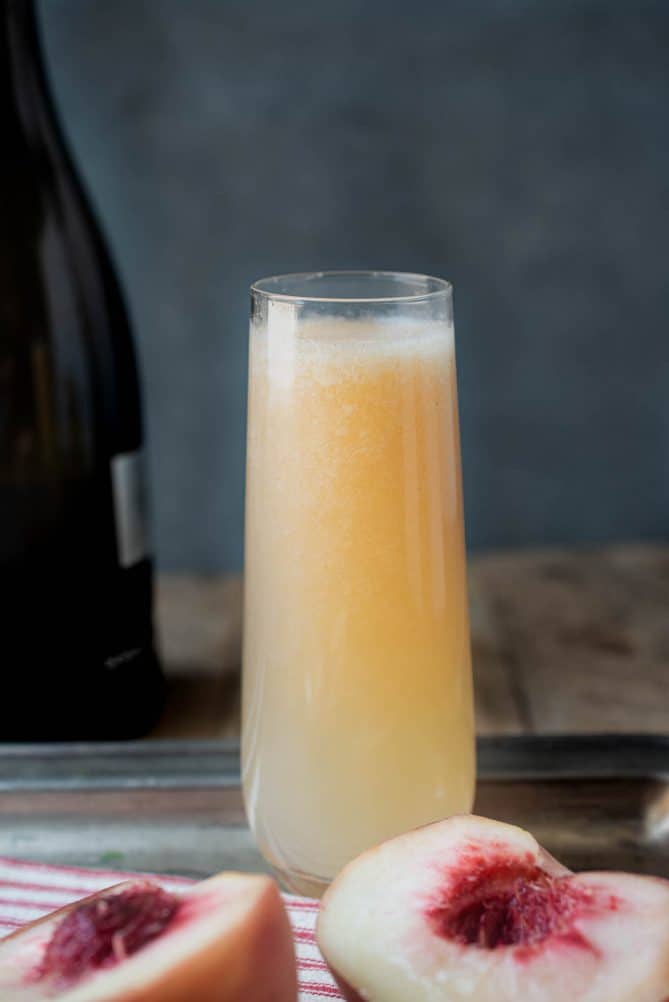 A beautiful peach hue color of the drink on a serving tray 