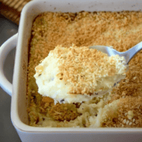 A casserole of mashed potatoes right out of the oven with a browned breadcrumb topping