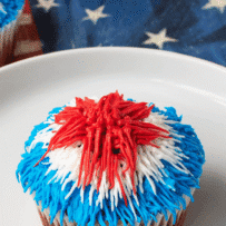 A patriotic color frosted red velvet cupcake