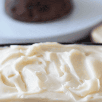 A closeup of creamy brandy butter in a tub